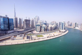 Spacious High-Floor 2BR Apartment with Full Burj Khalifa & Dubai Canal View